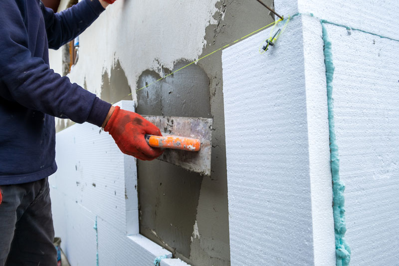 construction-worker-installing-styrofoam-insulatio-2022-08-14-08-35-16-utc